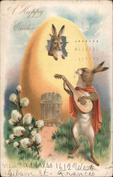 A Happy Easter - Rabbit inside an egg house being serenaded by another rabbit with guitar With Bunnies Postcard Postcard Postcard