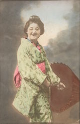 Colorized Picture of Traditional Japanese Woman Smiling and Facing the Camera holding an umbrella Postcard Postcard Postcard