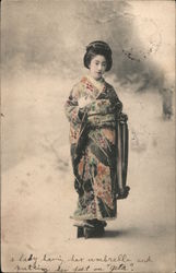 A lady having her umbrella and putting her feet on "geta" Japan Postcard Postcard Postcard