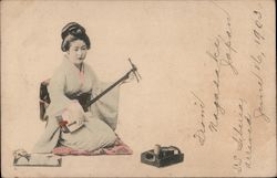 A Japanese lady playing a Shamisen Postcard Postcard Postcard