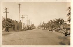 Main street view, vintage cars, electrical poles, street light, palm trees Postcard Postcard Postcard