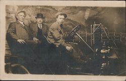 Three men in a car in a photo studio Postcard