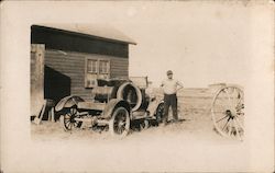 Antique car, wooden building, man, wooden wagon wheel vehicle Postcard