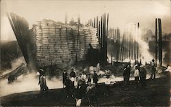 People gathered at remains of building after a fire, warehouse Postcard