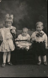 ELITE STUDIO Inscription - Group Photo of 3 Children Wearing Early 20th Century Formal Clothing Postcard