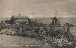 Chatham, windmill, flower beds, ocean Postcard