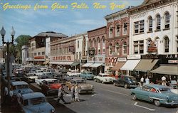 Looking up Glen Street from Bank Square showing part of business district Glens Falls, NY Postcard Postcard Postcard