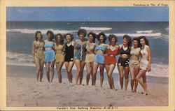 Women in bathing suits standing on the beach Postcard