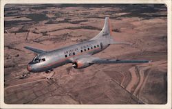 American Airlines, plane flying over land Postcard