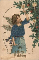 Angel in Blue Lighting Candles on Christmas Tree Postcard