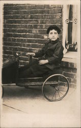 Boy in a Toy Car Postcard