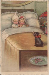 Two small children in bed are surprised by cute puppy wearing a red bow Postcard