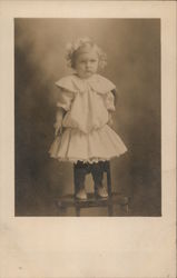 Little Girl in Dress Standing on Chair Postcard