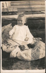 Baby Sitting on a Blanket Holding a Parasol Postcard