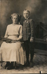 Professionally taken photo of 2 children in formal dress, circa 1900. Postcard Postcard Postcard