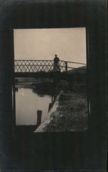 Woman On Footbridge Over Water Postcard