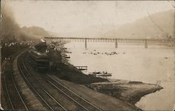 Passenger Train on Tracks Along River Side Postcard