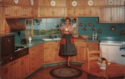 The Wood Mode custom designed kitchen being enjoyed by a woman having coffee Postcard