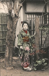 Woman standing outside with a traditional dress Postcard