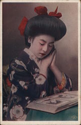 Woman Looking at Postcards or Photographs Postcard