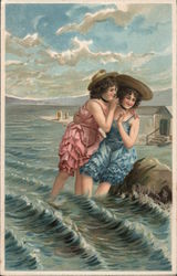 Two women with bathing outfits and sun hats hug and laugh in the ocean Postcard Postcard Postcard