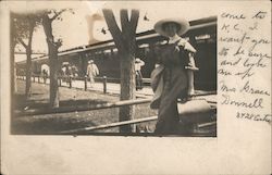 Woman at Train Depot Postcard