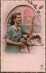 Woman in blue dress by a Window trying to get a Bird. Postcard