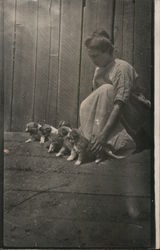 Girl Keeping Her Puppies in Line Postcard