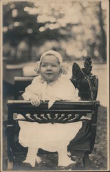 Baby on a Bench Postcard