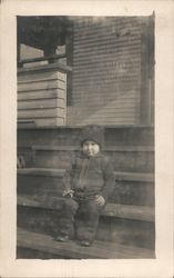 Young Boy Sitting on Steps Postcard