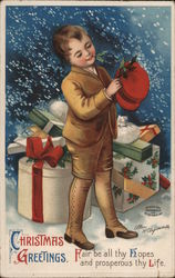 Christmas Greetings - A Boy with Presents and a Hat Children Ellen Clapsaddle Postcard Postcard Postcard