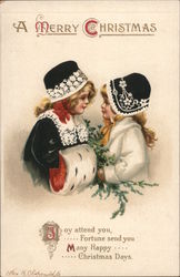 A Merry Christmas - two little girls in festive winter clothes and hats Children Postcard Postcard Postcard