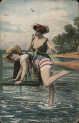 Smiling women having fun on beach - woman smoking cigarette, ready to spank other woman Postcard