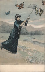 Woman catching a butterfly with a mans face on it. Postcard