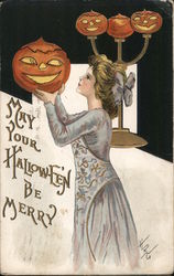 Girl Holding up Jack O'Lantern Postcard