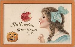 Girl with an apple and a jack-o-latern Halloween Postcard Postcard Postcard