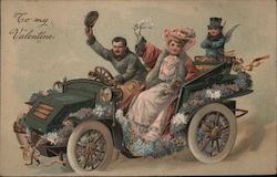 Couple driving a car covered in flowers with cupid riding on the back. Postcard