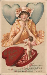 A Valentine's Heart - Cupid emerging from box of candy to greet a woman with a Valentine message Postcard Postcard Postcard