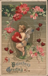 Cupid holding a heart sitting among pink flowers Postcard Postcard Postcard