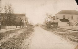 Dirt Road and Buildings Postcard