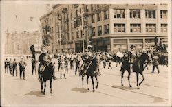 Men on horseback leading a parade Postcard