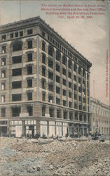 The debris on Market Street in front of the Market Street Bank and the new Post Office Building Postcard