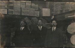 Three Men in a Storage Area Postcard