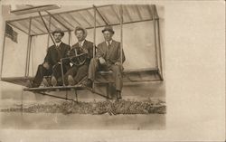 Three Men Posing on an Airplane Postcard