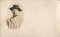 A Man in a Coat and Hat Postcard