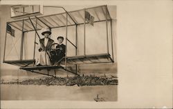 A Woman and Boy Posing in a Fake Glider Postcard