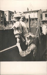 A Woman Holding Two Small Children in a Backyard San Francisco, CA Postcard Postcard Postcard