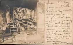 A Man Sitting on the Front Porch Postcard