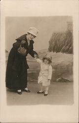 Woman and Child by Cliff Inn Beach Postcard