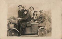 Several Adults Posing in a Car Postcard